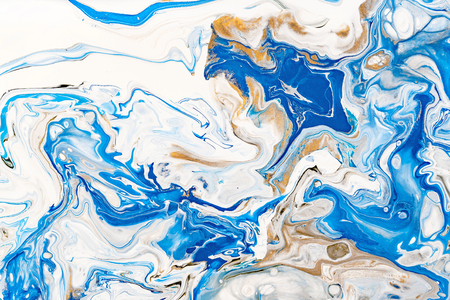 Hand painted background with mixed liquid blue, white, yellow paints. Abstract fluid acrylic painting. Applicable for packaging, invitation, textile, wallpaper, design of different surfacesの写真素材