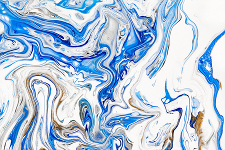 Hand painted background with mixed liquid blue, white, yellow paints. Abstract fluid acrylic painting. Applicable for packaging, invitation, textile, wallpaper, design of different surfacesの写真素材