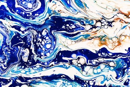 Hand painted background with mixed liquid blue, white, yellow paints. Abstract fluid acrylic painting. Applicable for packaging, invitation, textile, wallpaper, design of different surfacesの写真素材