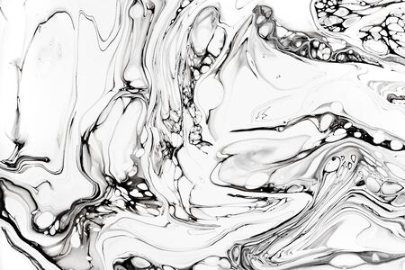 Abstract ink fluid marbled texture. Luxurious granite, marble mineral pattern wallpaper. Black and white minimalist liquid, fluid art backdrop. Oil, paint mix resin artworkの写真素材