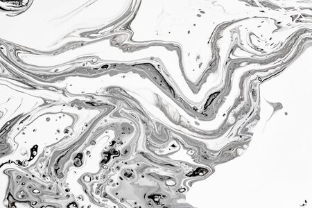 Abstract ink fluid marbled texture. Luxurious granite, marble mineral pattern wallpaper. Black and white minimalist liquid, fluid art backdrop. Oil, paint mix resin artworkの写真素材