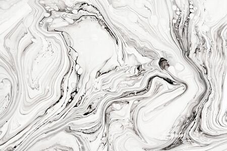 Abstract ink fluid marbled texture. Luxurious granite, marble mineral pattern wallpaper. Black and white minimalist liquid, fluid art backdrop. Oil, paint mix resin artworkの写真素材