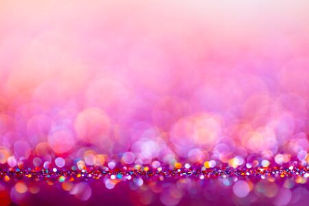 Decoration bokeh glitters background, abstract sparkle backdrop with circles,modern design overlay with sparkling glimmers. Purple, white and golden backdrop glittering sparks with glow effectの写真素材
