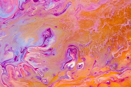 Fluid art texture. Abstract backdrop with mixing paint effect. Liquid acrylic picture with trendy mixed paints. Can be used for website background. Purple, golden, orange and blue overflowing colorsの写真素材