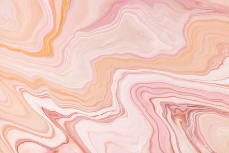 Fluid art texture. Background with abstract iridescent paint effect. Liquid acrylic artwork that flows and splashes. Mixed paints for interior poster. Orange, pink and white overflowing colorsの写真素材
