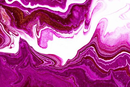 Fluid art texture. Background with abstract mixing paint effect. Liquid acrylic artwork that flows and splashes. Mixed paints for posters or wallpapers. Purple, golden and white overflowing colorsの写真素材