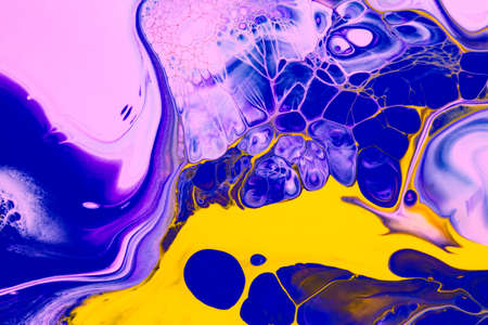 Fluid art texture. Abstract background with swirling paint effect. Liquid acrylic picture that flows and splashes. Mixed paints for baner or wallpaper. Yellow, blue and pink overflowing colorsの写真素材