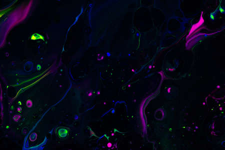Fluid art texture. Abstract background with swirling paint effect. Liquid acrylic picture that flows and splashes. Mixed paints for website background. Black, purple and green overflowing colorsの写真素材