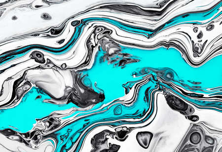 Fluid art texture. Abstract backdrop with mixing paint effect. Liquid acrylic picture with colorful mixed paints. Can be used for background or poster. Black, white and aquamarine overflowing colorsの写真素材