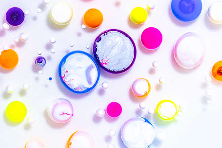 Fluid art texture. Abstract backdrop with mixing paint effect. Liquid acrylic artwork that flowing bubbles. Mixed paints for background or poster. Neon overflowing colorsの写真素材