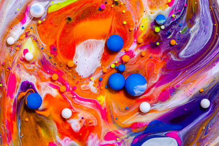 Fluid art texture. Background with abstract swirling paint effect. Liquid acrylic picture with flowing bubbles. Mixed paints for posters or wallpapers. Vibrant overflowing colorsの写真素材