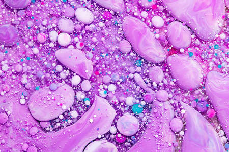 Fluid art texture. Abstract background with mixing paint effect. Liquid acrylic picture that flowing bubbles. Mixed paints for background or poster. Purple, aquamarine and white overflowing colorsの写真素材