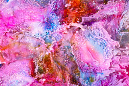 Resin art texture with multicolor blasts. Liquid background with splashes and ripples. Abstract frozen artwork with splatter inks. Vibrant colors mixes and overflows on macrophotography wallpaperの写真素材