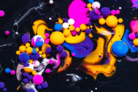 Fluid art texture. Backdrop with abstract mixing paint effect. Liquid acrylic picture that flowing bubbles. Mixed paints for baner or wallpaper. Black and neon overflowing colorsの写真素材