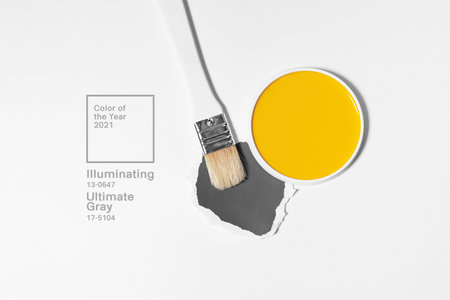 White brush on light background with trend and mod colors of 2021 year. Minimalistic picture for article, banner or poster. Yellow and gray paletteの写真素材