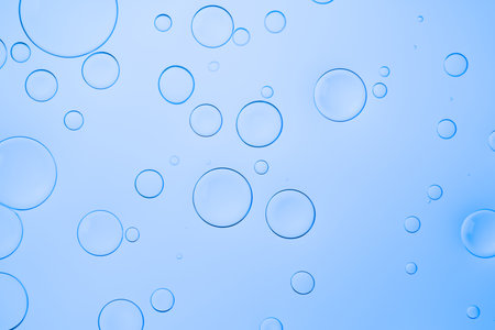 Water background with bubbles for website, advertising cosmetics and other product. Colorful abstract backdrop with bright gradients on blobs. Blue overflowing colorの写真素材