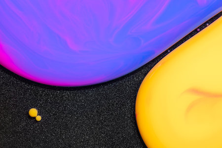 Fluid art texture. Background with abstract swirling paint effect. Liquid acrylic picture with mixed paints and bubbless. Can be used for posters or wallpapers. Black and bright overflowing colorsの写真素材
