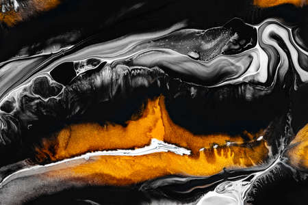 Fluid art texture. Background with abstract swirling paint effect. Liquid acrylic artwork with beautiful mixed paints. Can be used for interior poster. Golden, black and gray overflowing colorsの写真素材