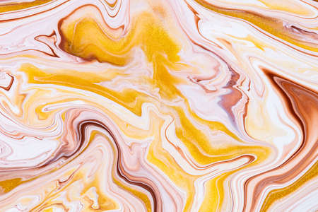Fluid art texture. Abstract background with iridescent paint effect. Liquid acrylic artwork with trendy mixed paints. Can be used for website background. Golden, brown and white overflowing colorsの写真素材