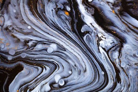 Fluid art texture. Backdrop with abstract swirling paint effect. Liquid acrylic picture with artistic mixed paints.の写真素材
