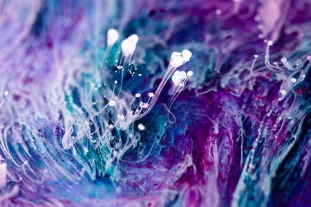 Epoxy resin texture with blue, purple and white colors. Liquid backdrop with splashes and swirls. Abstract frozen texture with alcohol inks.の写真素材