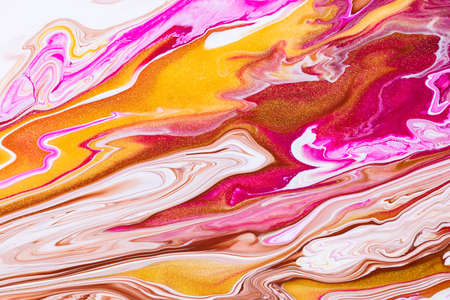 Fluid art texture. Abstract background with iridescent paint effect. Liquid acrylic artwork with flows and splashes. Mixed paints for posters or wallpapers. Golden, white and ruby overflowing colorsの写真素材