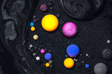 Fluid art texture. Backdrop with abstract swirling paint effect. Liquid acrylic picture with mixed paints and bubbless. Can be used for posters or wallpapers. Black and colorful overflowing colorsの写真素材