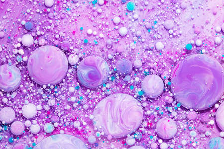 Fluid art texture. Abstract backdrop with mixing paint effect. Liquid acrylic picture that flowing bubbles. Mixed paints for interior poster. Lavender, aquamarine and white overflowing colorsの写真素材