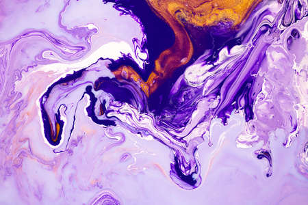 Fluid art texture. Backdrop with abstract mixing paint effect. Liquid acrylic picture with flows and splashes. Mixed paints for posters or wallpapers. Purple, lavender and golden overflowing colorsの写真素材