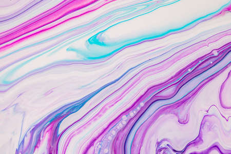 Fluid art texture. Background with abstract iridescent paint effect. Liquid acrylic picture with beautiful mixed paints. Can be used for interior poster. Purple, pink and white overflowing colorsの写真素材