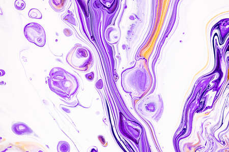 Fluid art texture. Abstract background with mixing paint effect. Liquid acrylic picture with flows and splashes. Mixed paints for posters or wallpapers. Purple, white and golden overflowing colorsの写真素材