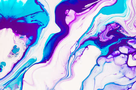 Fluid art texture. Background with abstract iridescent paint effect. Liquid acrylic artwork with beautiful mixed paints. Can be used for interior poster. Blue, purple and white overflowing colors.の写真素材