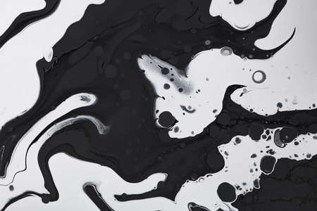 Fluid art texture. Background with abstract swirling paint effect. Liquid acrylic picture with colorful mixed paints. Can be used for background or poster. Black, white and gray overflowing colors.の写真素材