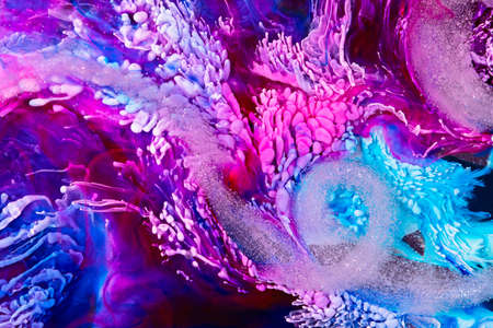 Resin art paint with pink, turquoise and wine colors. Liquid backdrop with splashes and ripples. Modern abstract texture with alcohol inks. Bright pigments mixes on macrophotography poster.の写真素材