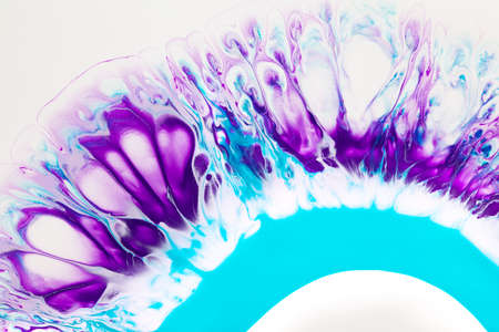 Fluid art texture. Background with abstract mixing paint effect. Liquid acrylic picture with flows and splashes. Mixed paints for interior poster. Turquoise, purple and white overflowing colors.の写真素材