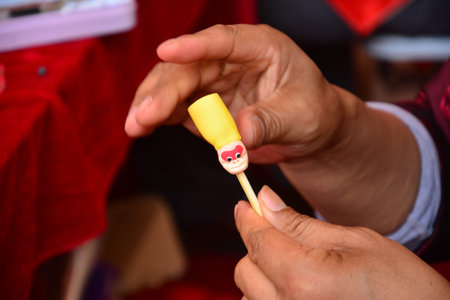Hand making a flour dollの写真素材