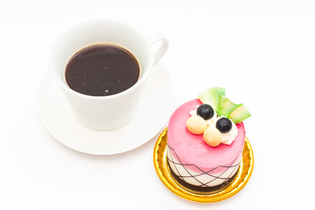 blueberry cupcake with black coffee in white coffee mug on white backgroundの写真素材