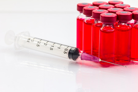the vaccine and a hypodermic syringe must use a pairの写真素材