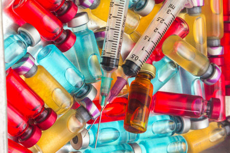 the vaccine and a hypodermic syringe must use a pairの写真素材