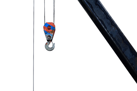 Big harbor cranes hooks hanging on steel ropes isolated on white backgroundの写真素材