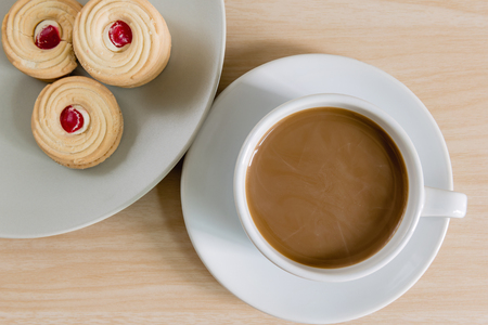 top view of coffee cup on wooden backgroundの写真素材