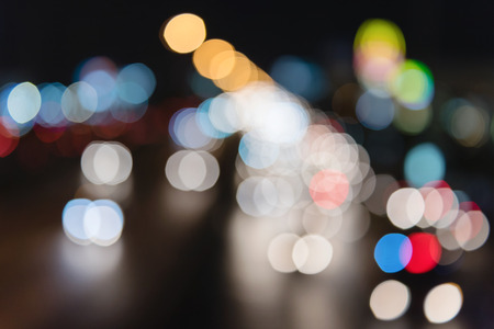 Artistic style - Defocused urban abstract texture ,bokeh of city lights on expressway in the background with blurring lights for your designの写真素材