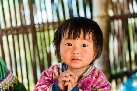 Chiangmai,Thailand - December 6: unidentified little girl Dara-ang Palaung smiling , Palaung people is a minority ethnic group living in northern Thailand, Chiang Mai Province Thailand 6 December 2015のeditorial素材