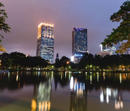 BANGKOK - Jan 3: Lake view of Lumpini Park in the Thai capital's city centre on jan 3, 2016 in Bangkok, Thailand. Lumpini Park is the big park in center of Bangkok covers 142 acres with 2.5 km of pathways and a large boating lakeのeditorial素材