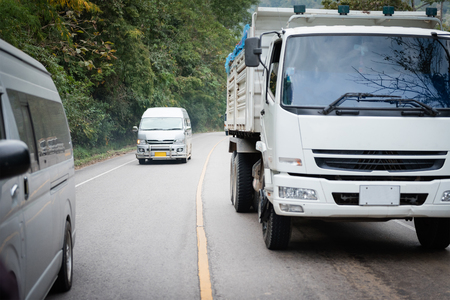 A van driving at high speeds, overtaking other carsの写真素材