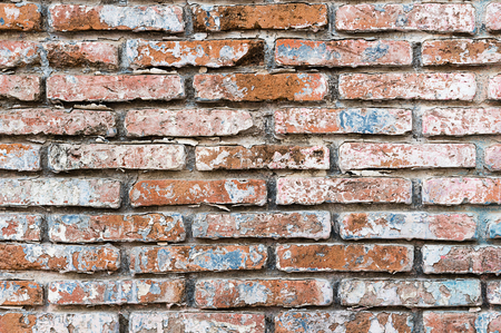 Old brick wall in a background image, colorful brick wall backgroundの写真素材