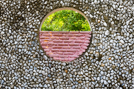 hole in old stone wallの写真素材