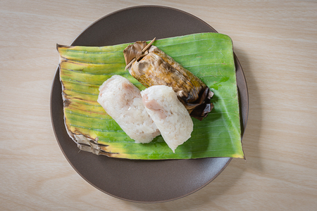 Thai style dessert, Toast stuffed with sticky rice, Grilled sticky rice with taro and banana and coconut milk on banana leavesの写真素材