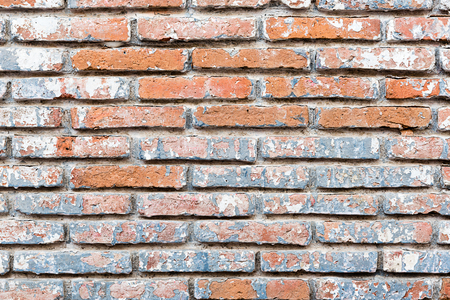 Old brick wall in a background image, colorful brick wall backgroundの写真素材