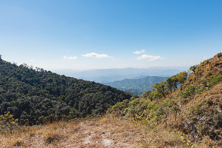 mountain gap, mountain layer with bright sunset on the sky at Doi Tu Lay (Mon Tu Lay) , Tak province Thailandの写真素材
